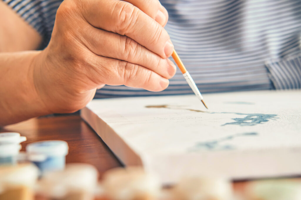Old,Woman,Painting,By,Numbers,At,Home,Close-up.,Inspirational Old woman painting by numbers at home