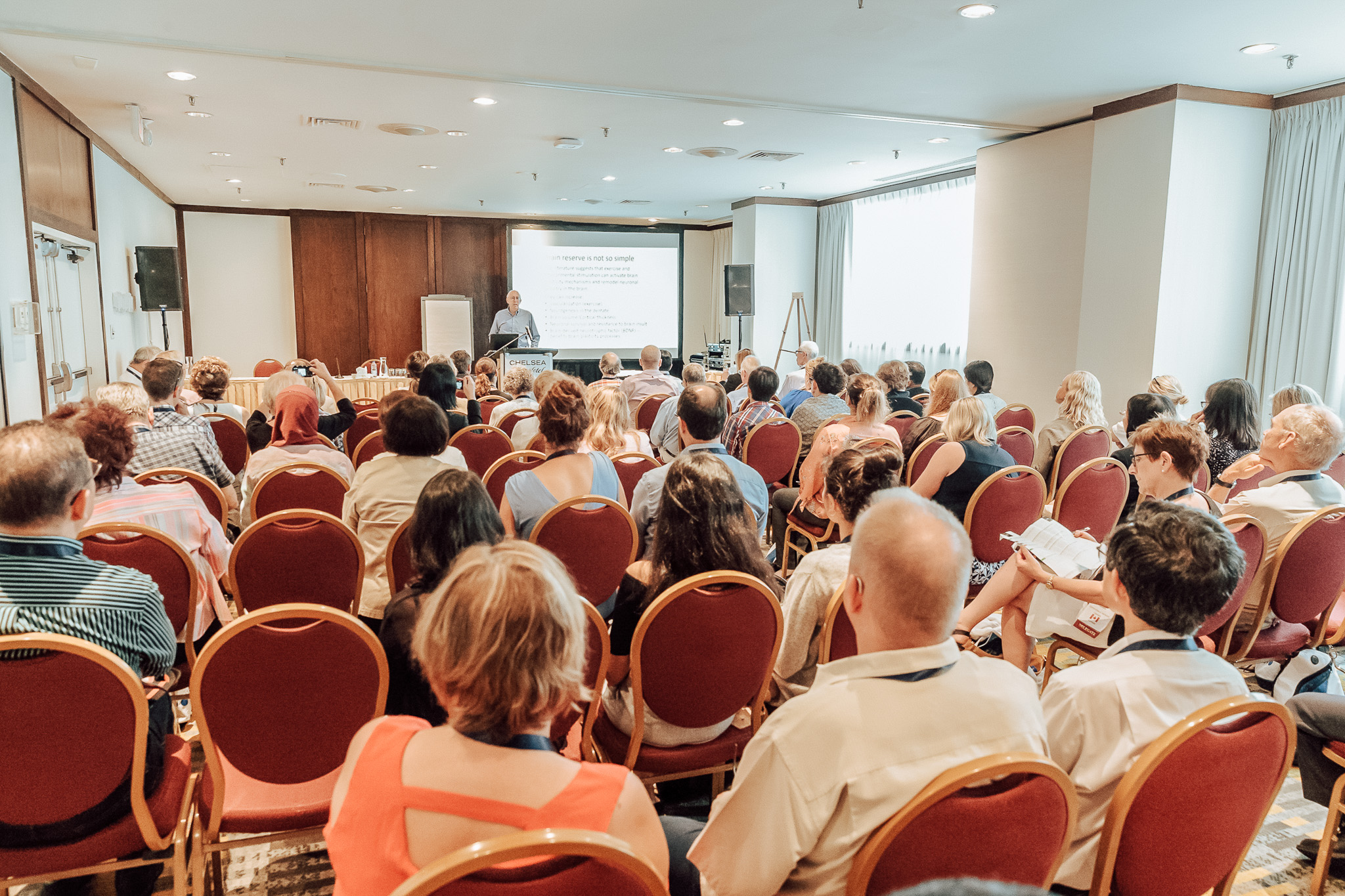 group of people gathering in a conference group of people gathering in a conference